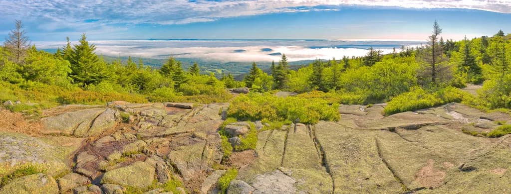 Whispers of the Mist: A Serene Mountain Vista at Dawn