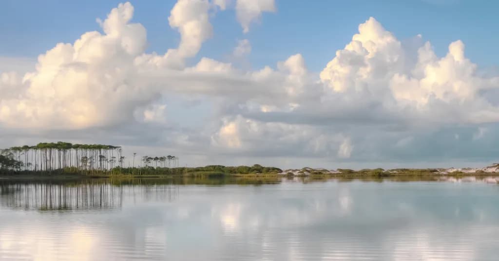 Serenity in Reflection: A Tranquil Landscape of Clouds and Water
