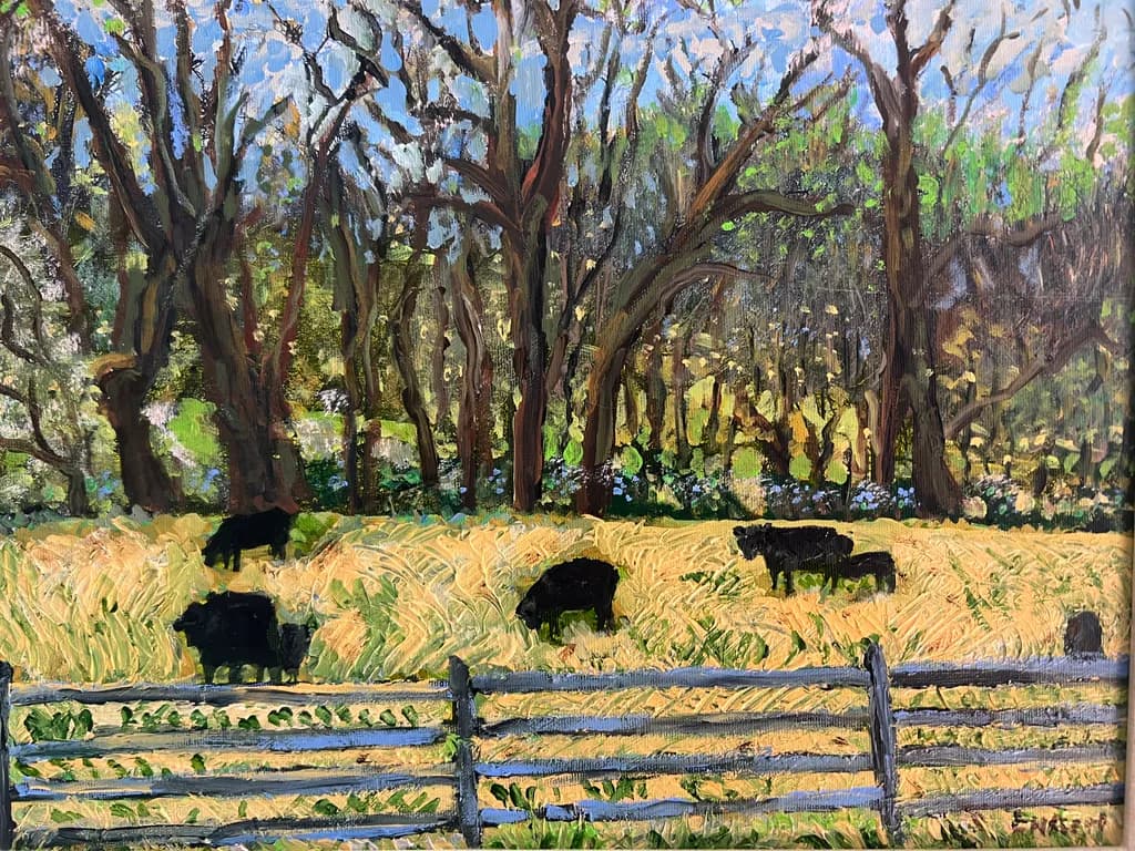 Serene Pastures: Cows Grazing Under the Canopy of Trees