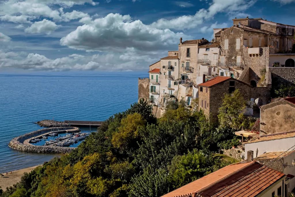 Coastal Charm: A Scenic Marina Embraced by Clouds and Architecture