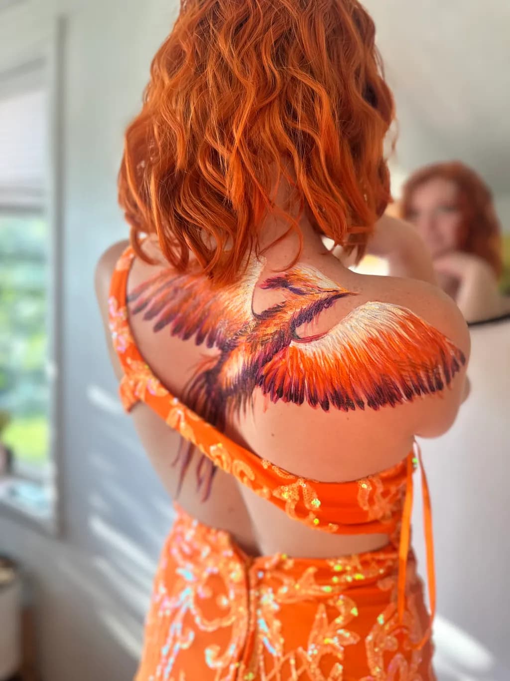 Phoenix Rising: A Vibrant Tattoo of Transformation and Reflection