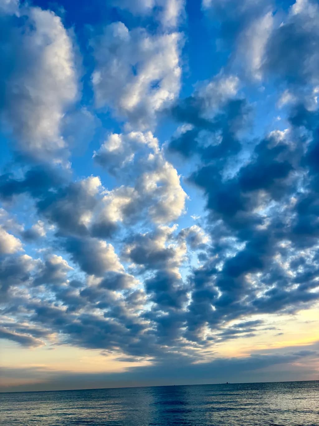 Serenity in Blue: A Tranquil Reflection of Sky and Water