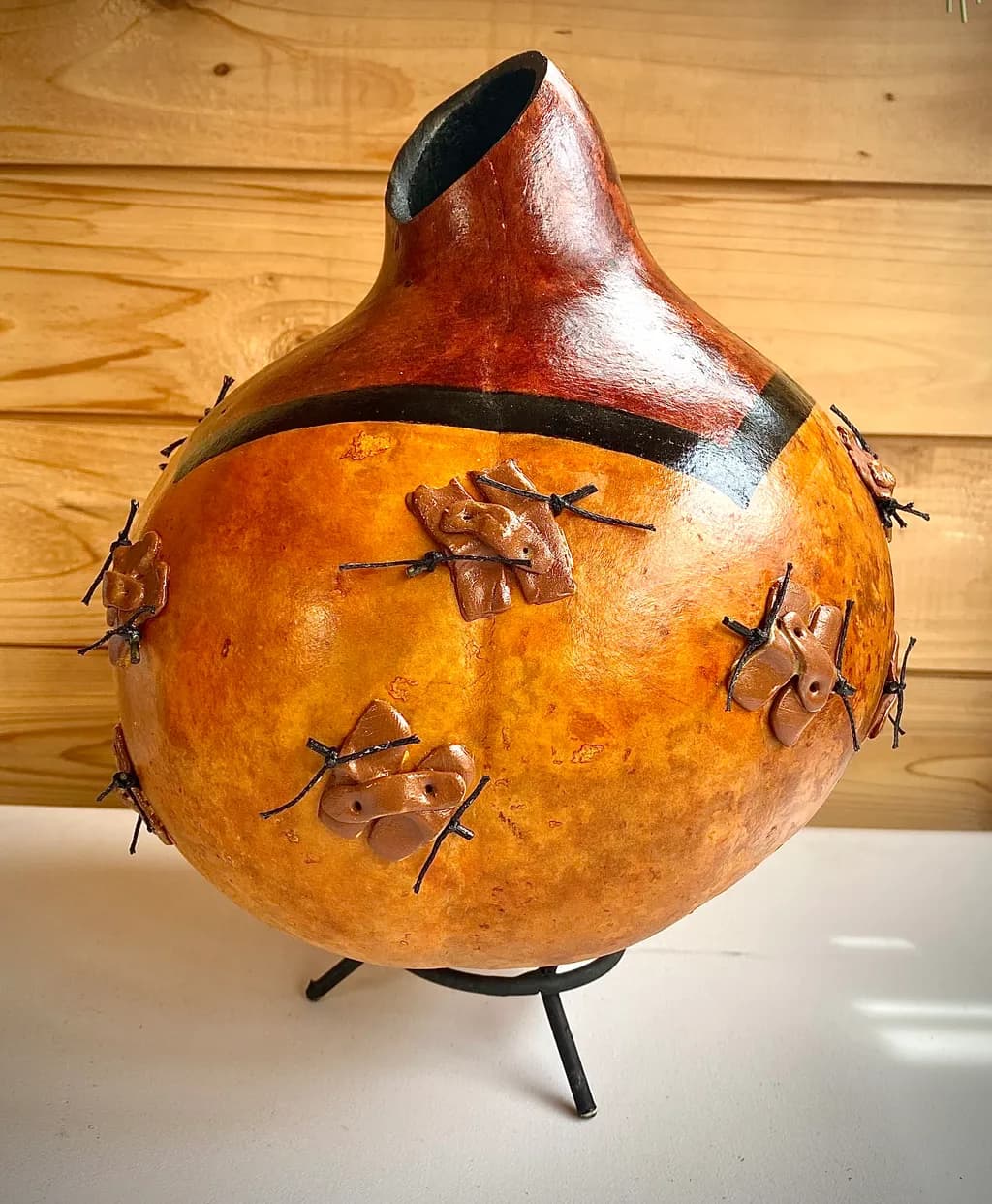 Whimsical Gourd Vessel with Textured Leaf Accents and Earthy Tones