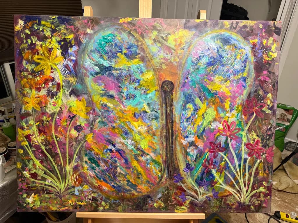 Whispers of Transformation: A Vibrant Butterfly Amidst Blossoming Flora