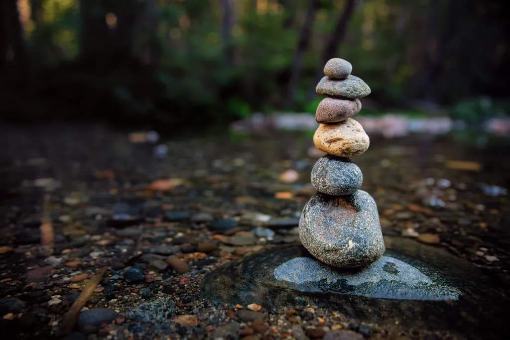 Balanced Serenity: A Tranquil Stone Tower in Nature's Embrace