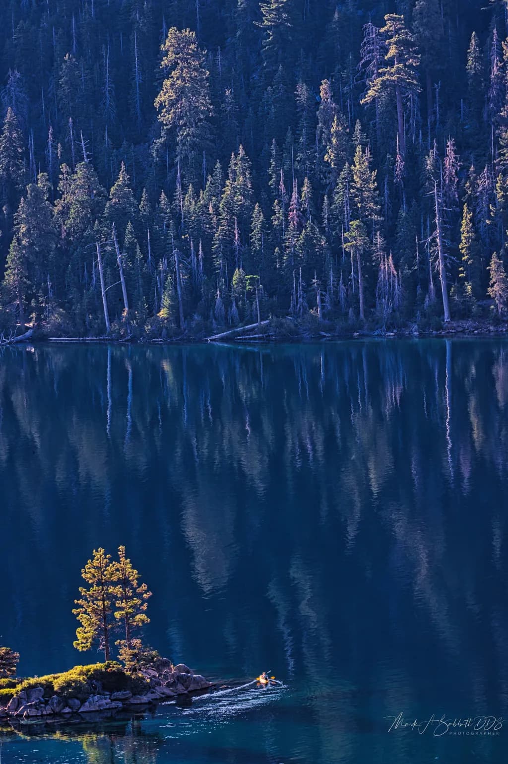 Whispers of Serenity: A Kayaker's Journey Through Tranquil Reflections in Nature's Embrace