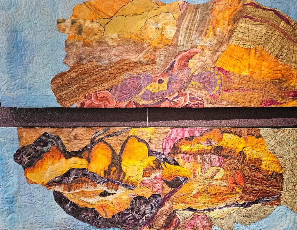 "layers of the earth: a quilted journey through color and texture"