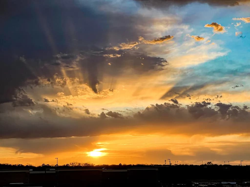 Golden Horizon: A Serene Sunset Embracing the Sky's Canvas