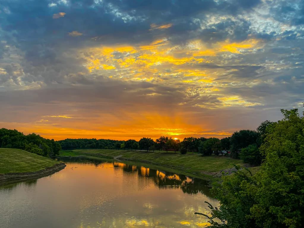 Serenity at Sunset: A Tranquil Reflection on the River's Edge