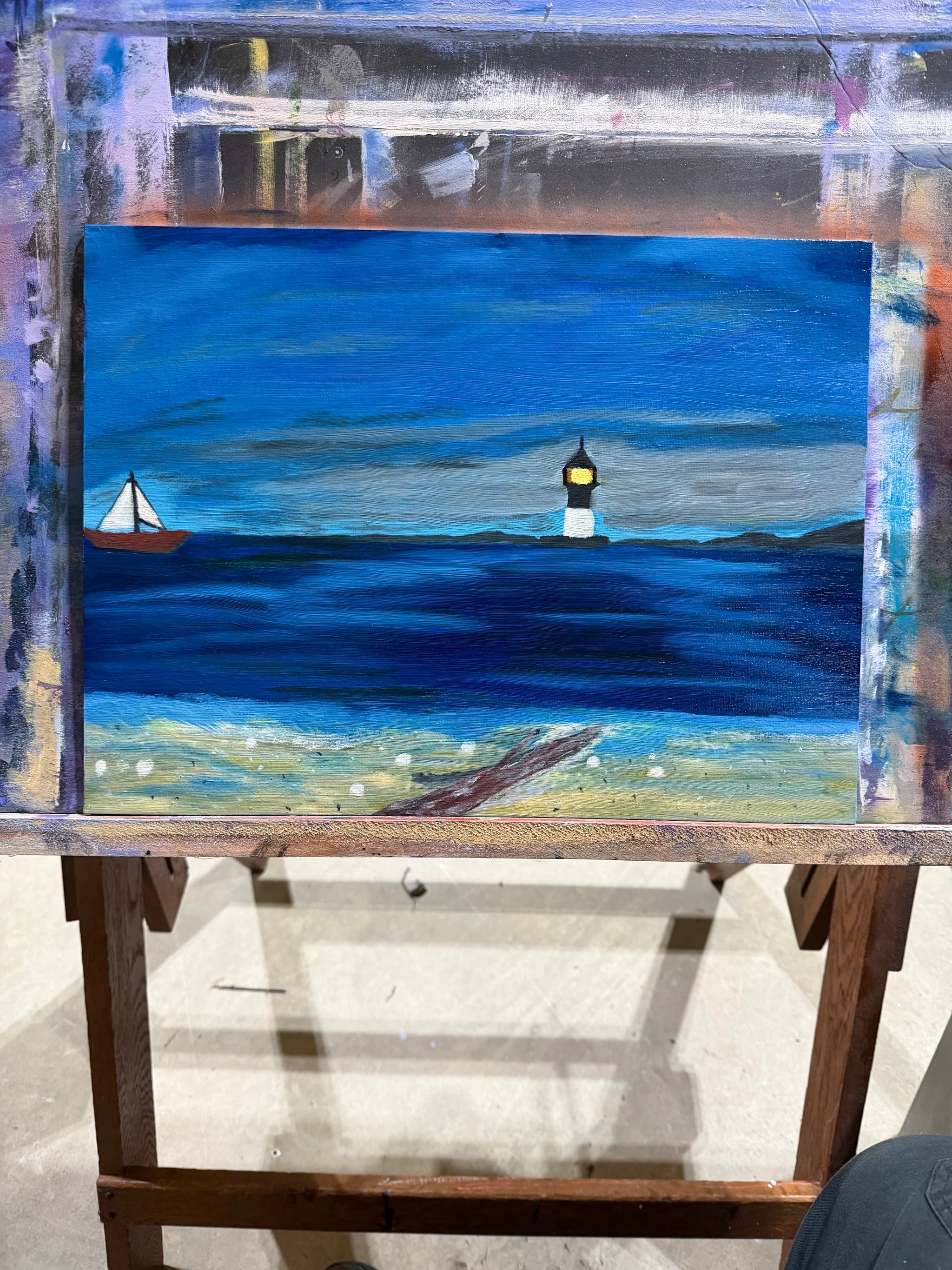Lighthouse and Sailboat at Sea