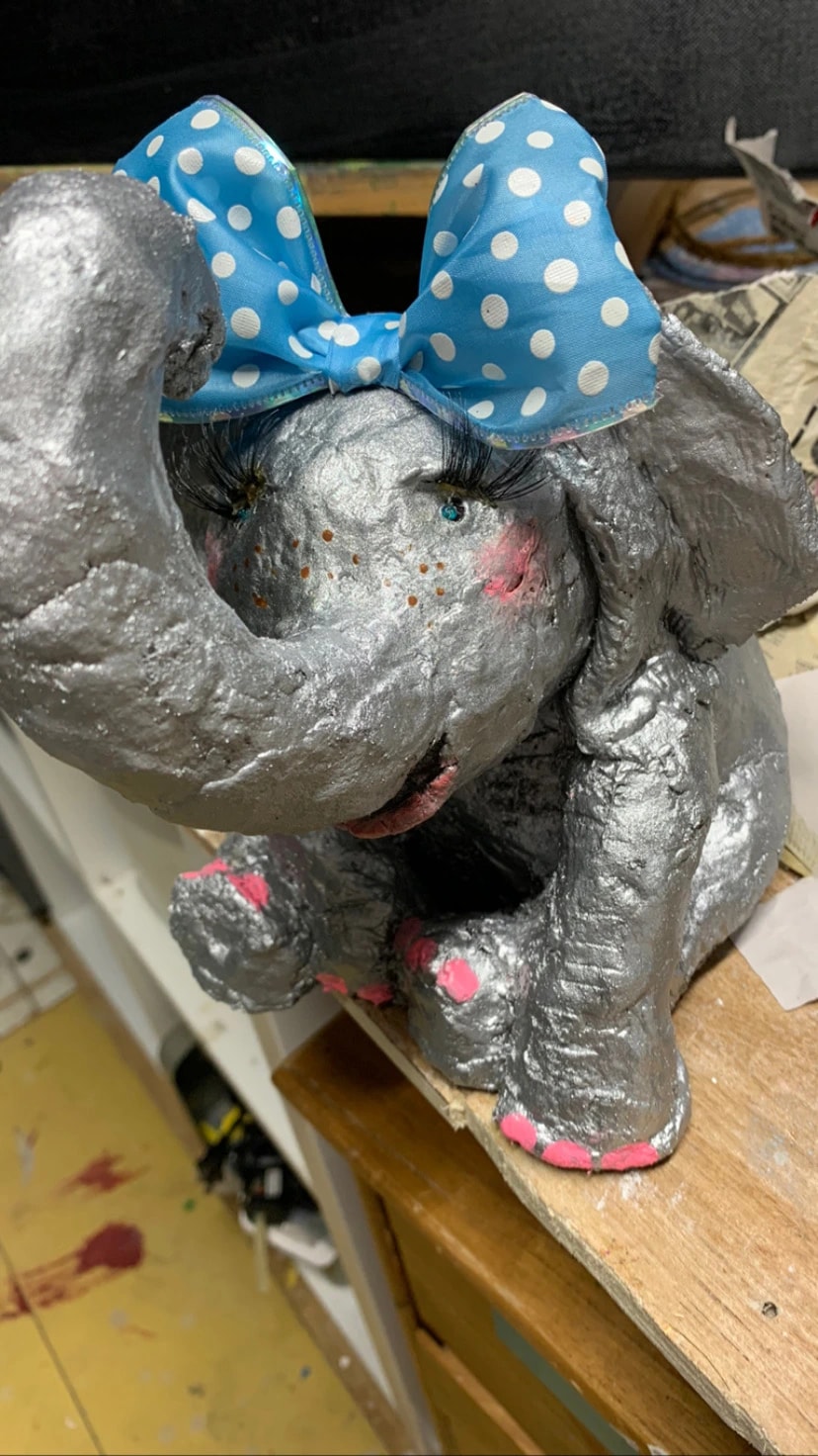 Whimsical Silver Elephant: A Heartfelt Tribute to Joy and Resilience