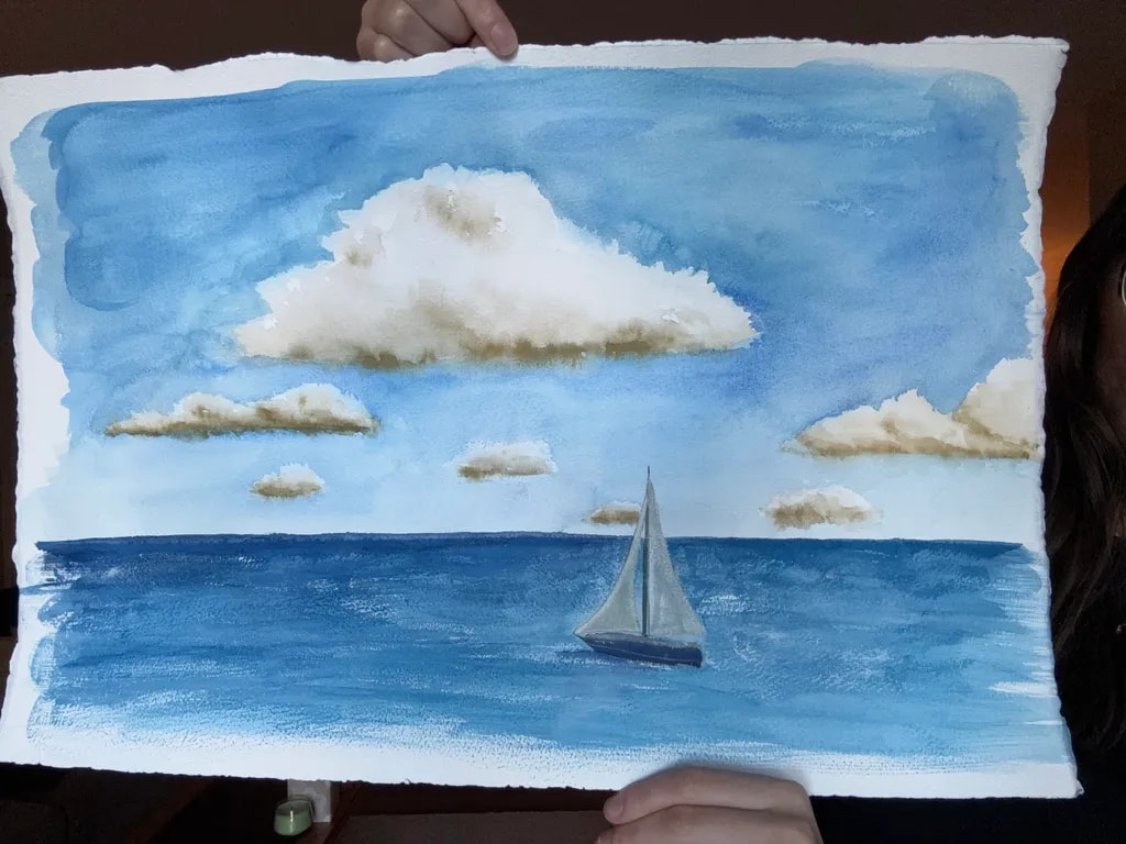 Sailboat Beneath Coastal Clouds