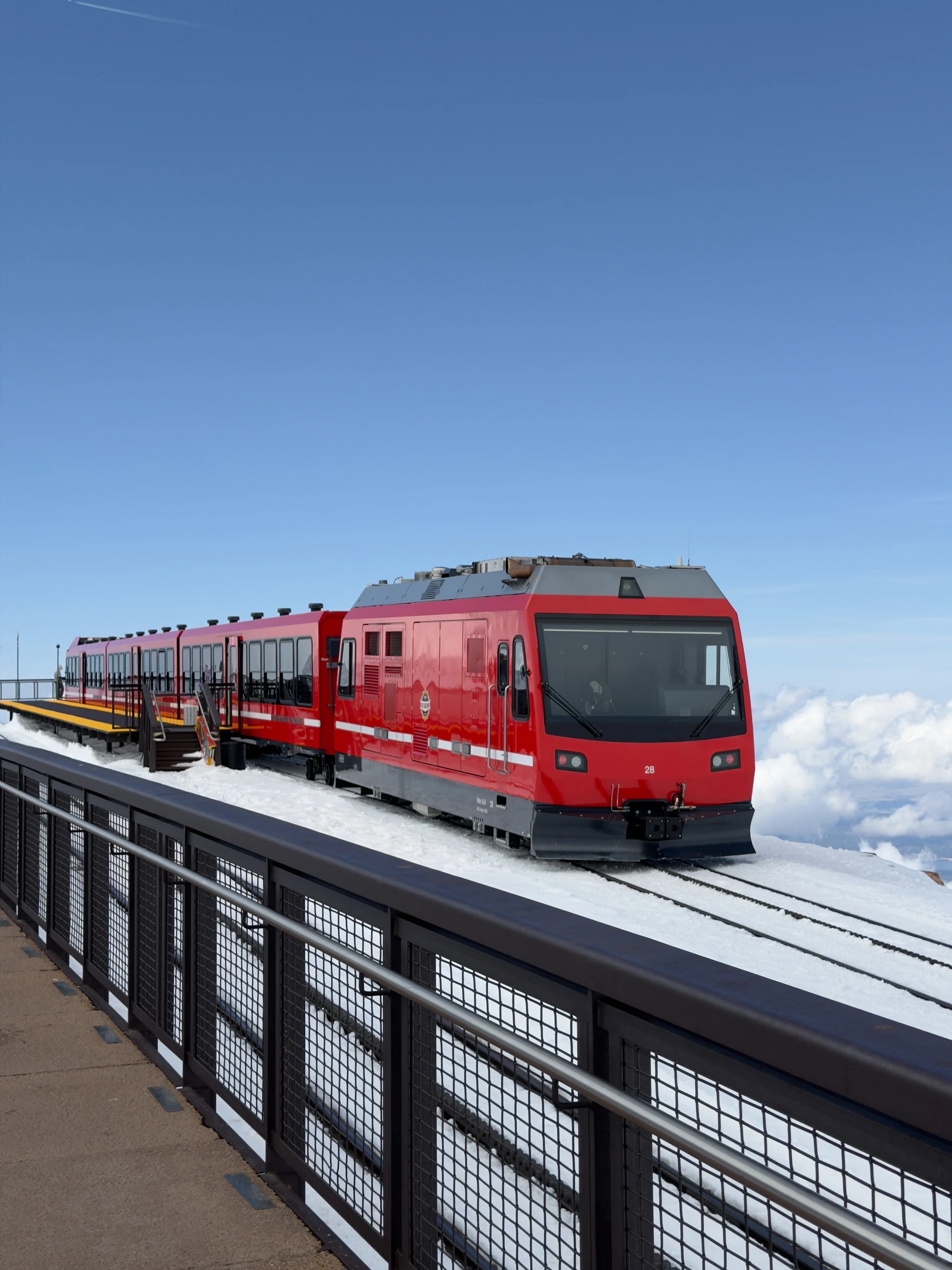 Red Train Above the Clouds