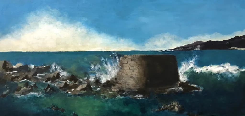 Serenity by the Sea: Waves Embracing the Rocky Shoreline Under a Vast Sky