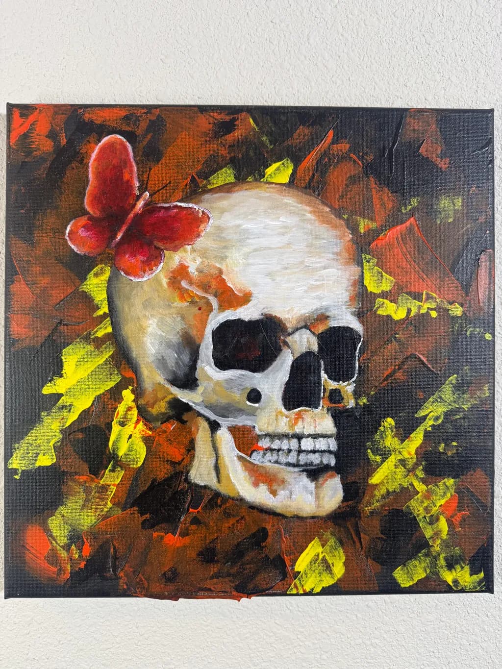 Whispers of Mortality: A Skull Adorned with a Crimson Butterfly
