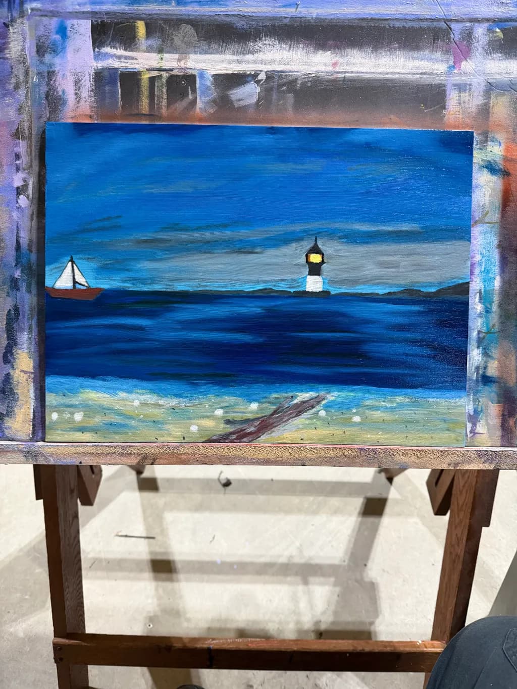 Lighthouse and Sailboat at Sea