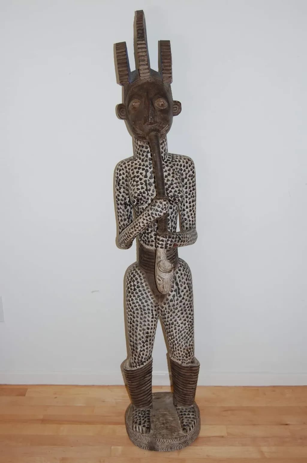 Flute Player Sculpture