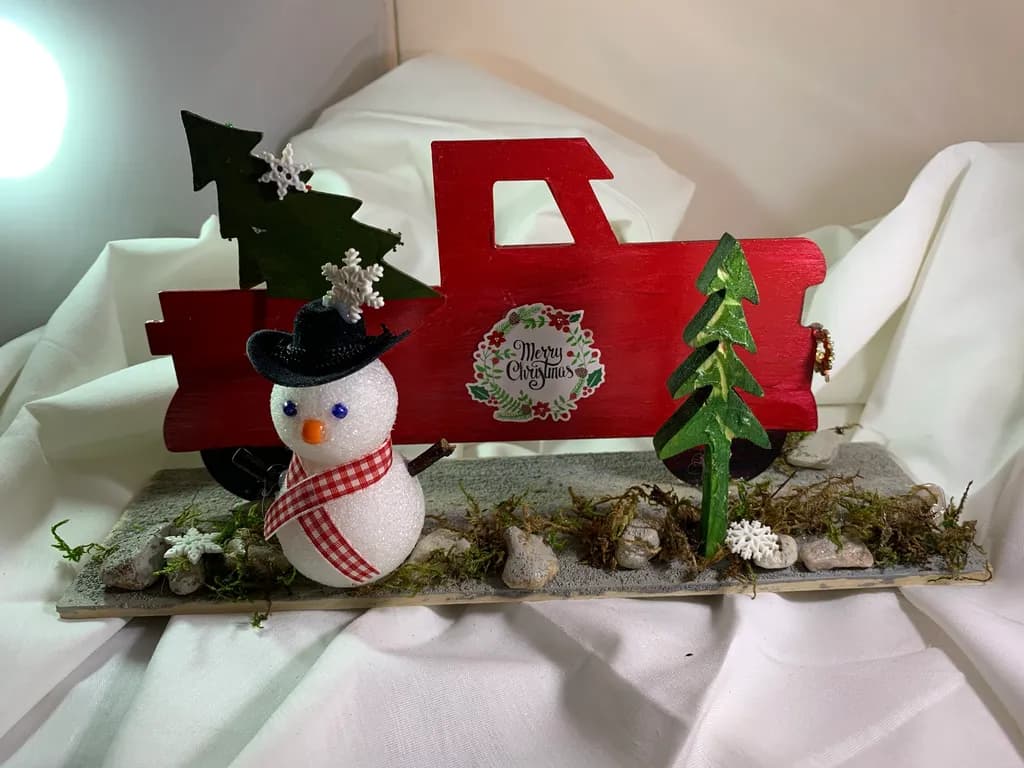 Festive Winter Wonderland: A Charming Snowman and Truck Christmas Decoration