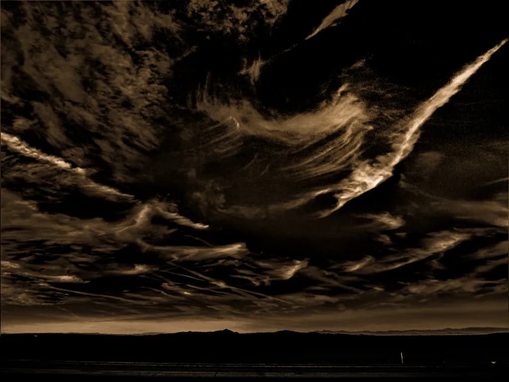 Whispers of the Night Sky: A Dramatic Dance of Clouds and Shadows