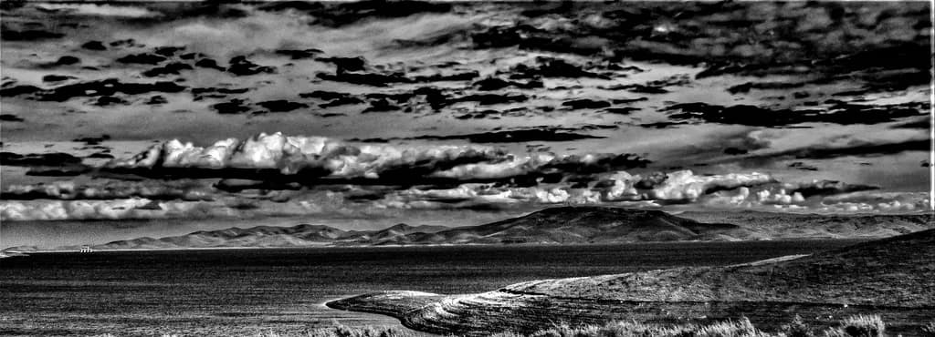 Whispers of the Monochrome Horizon: A Serene Landscape in Black and White