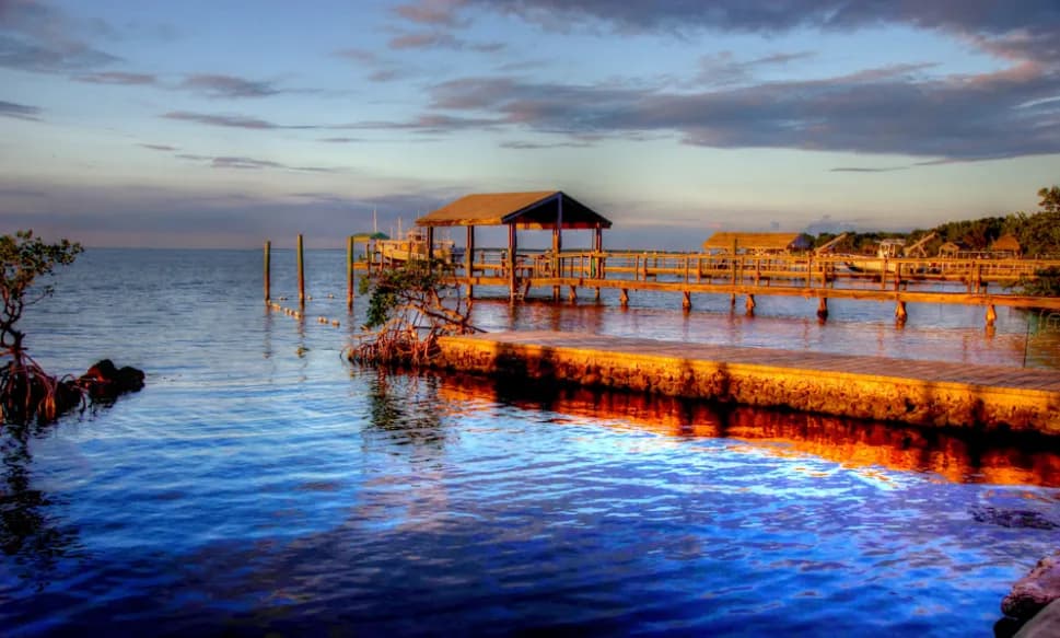 Whispers of the Water: A Serene Sunset Over the Dockside Dreamscape