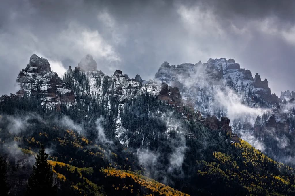 Whispers of the Mountains: A Majestic Dance of Snow and Mist
