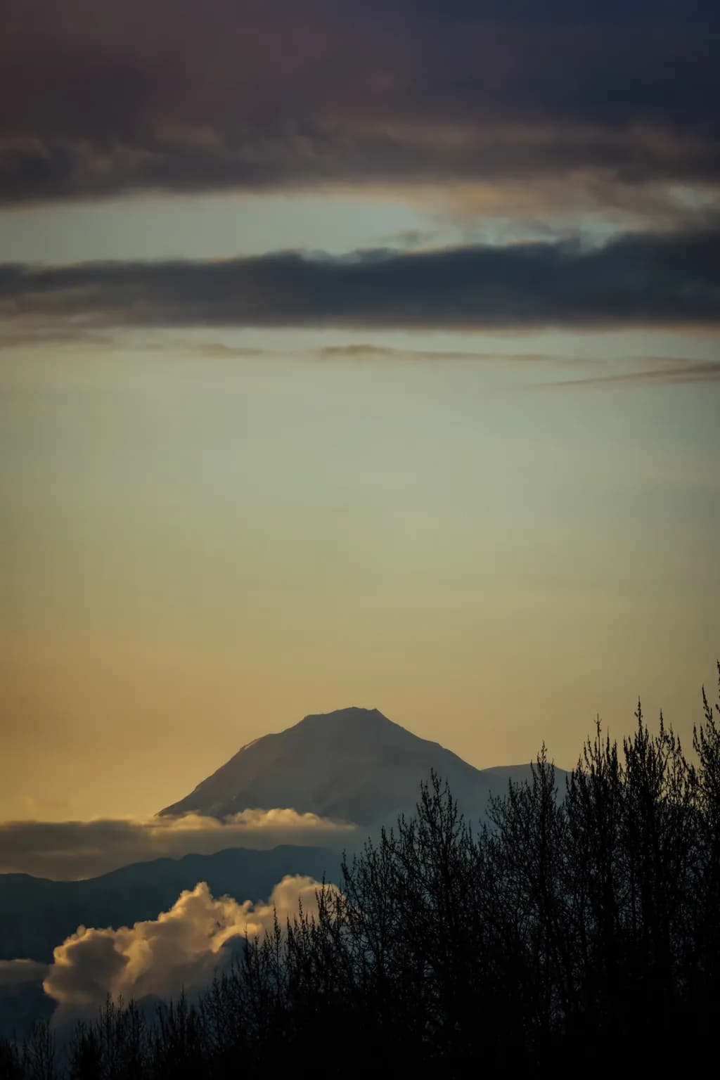 Clouds Cradle the Quiet Summit