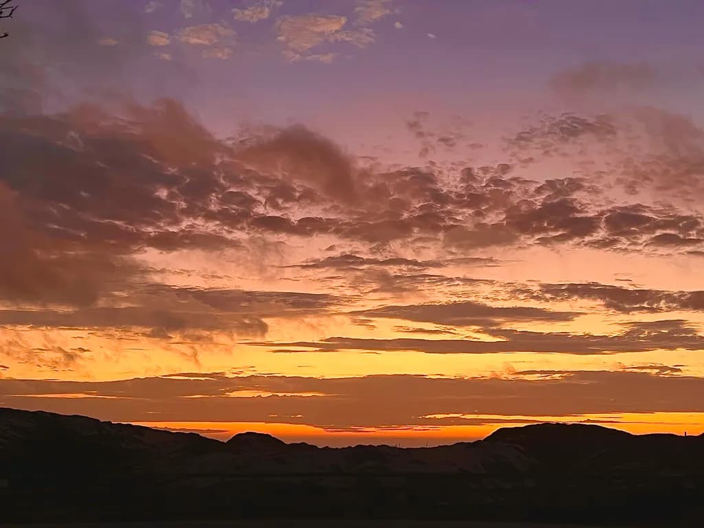 Ethereal Sunset: A Dance of Colors Over the Horizon
