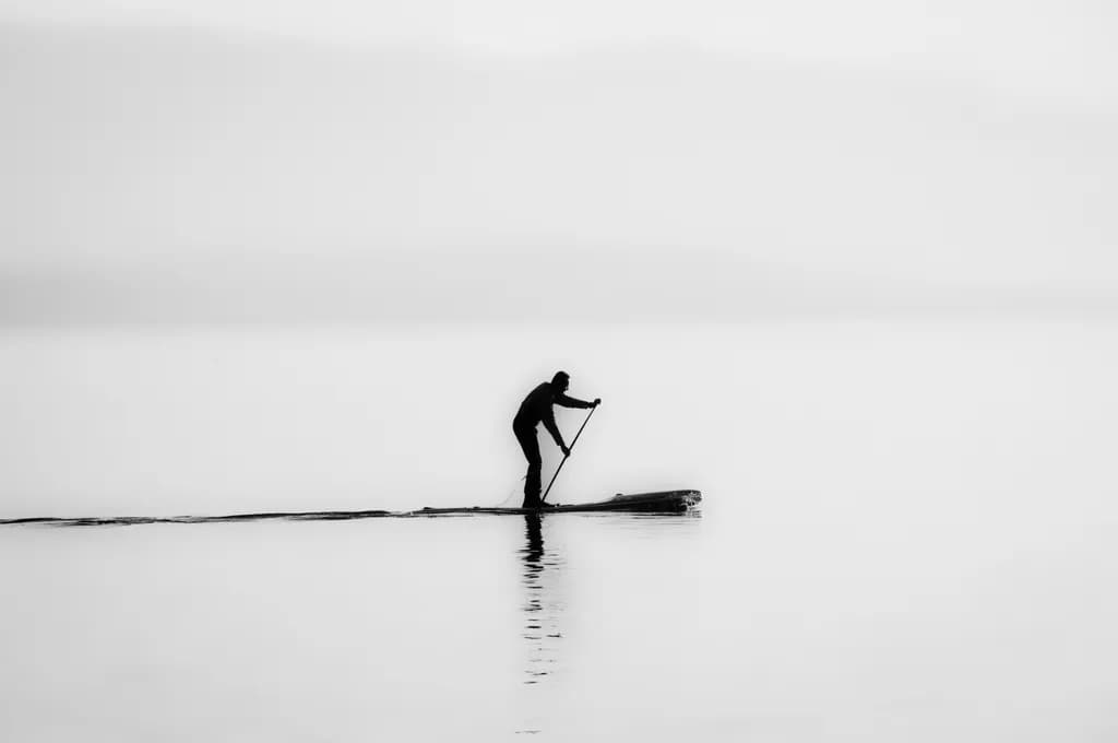 Silent Reflections: A Monochrome Journey of Solitude on Water