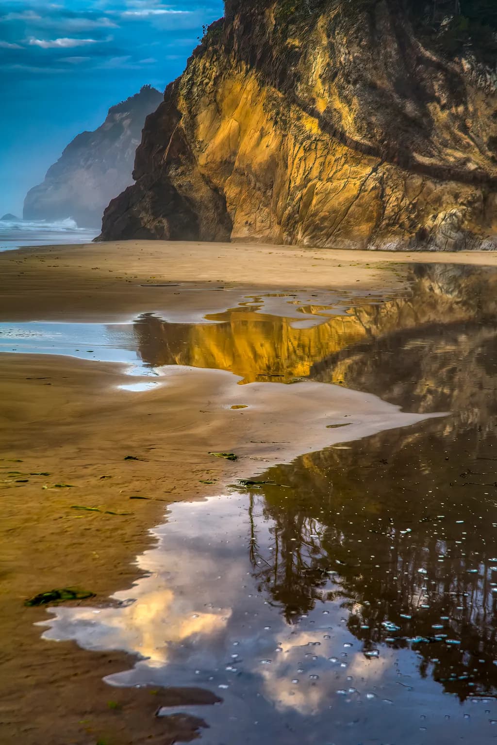 Serenity by the Shore: A Coastal Reflection of Cliffs and Sky