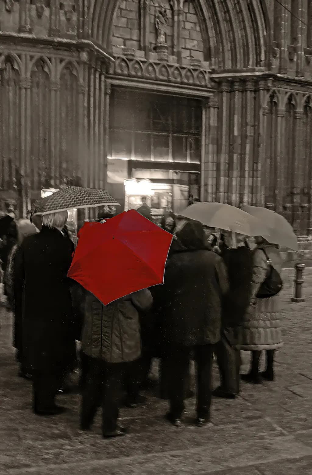 Beneath Gothic Light — A Red Umbrella Holds a Quiet World