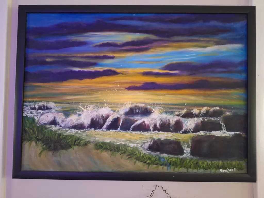 Whispers of the Ocean: A Serene Sunset Over Rocky Shores