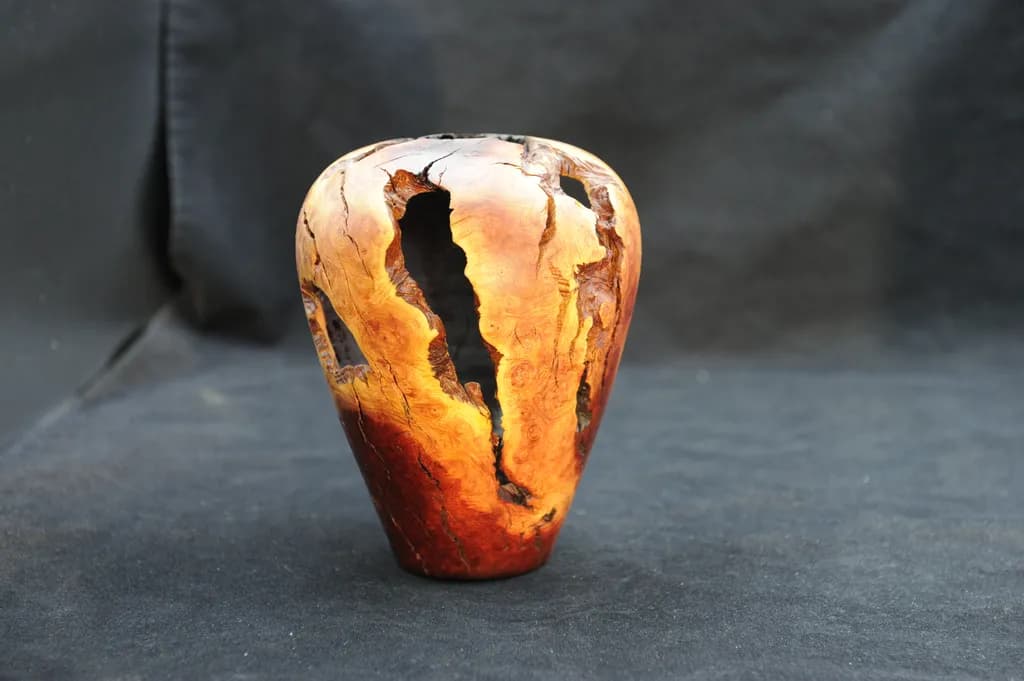 Nature's Embrace: A Whimsical Dance of Wood and History in a Unique Pottery-Inspired Vessel