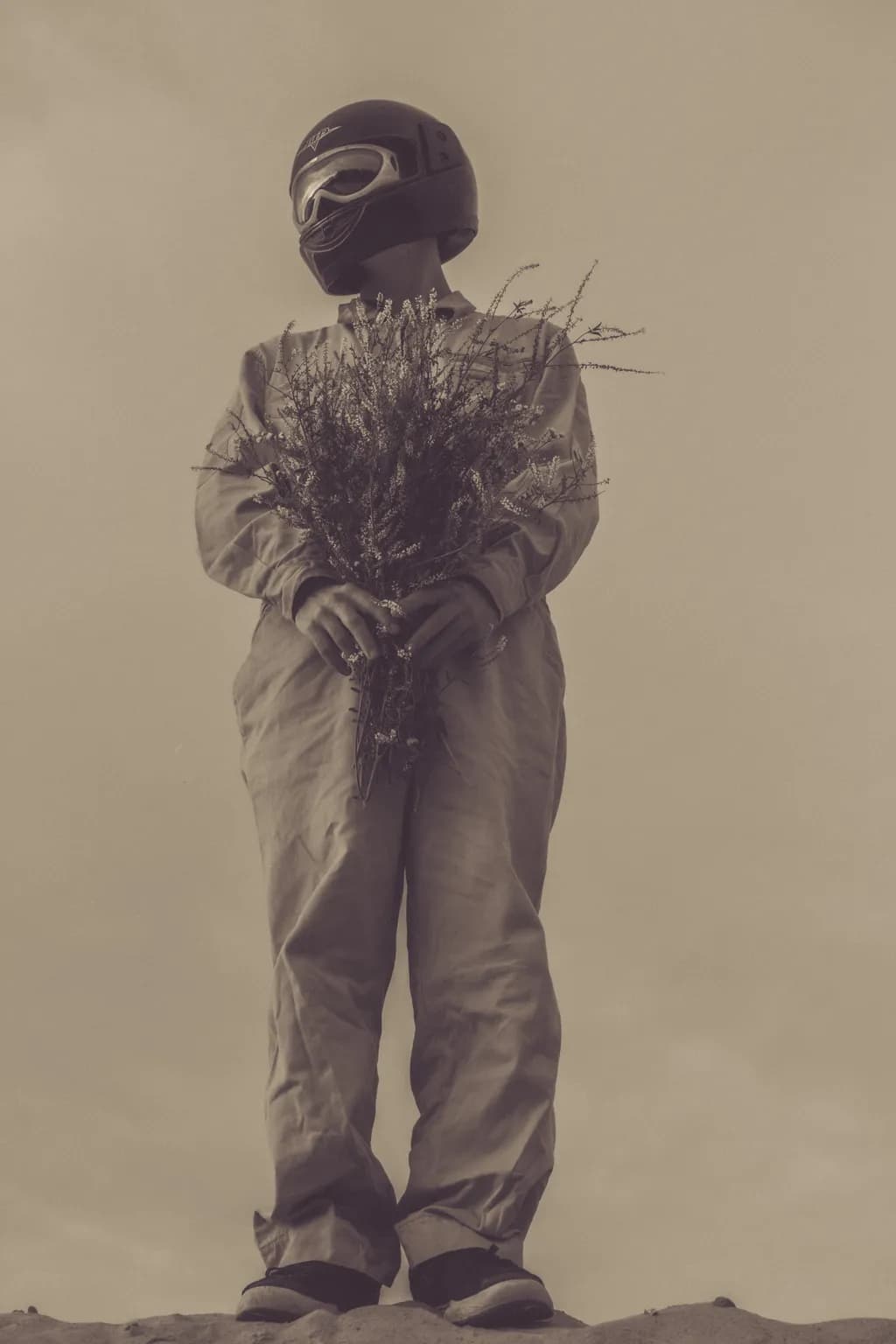 Helmeted Figure with Wildflowers