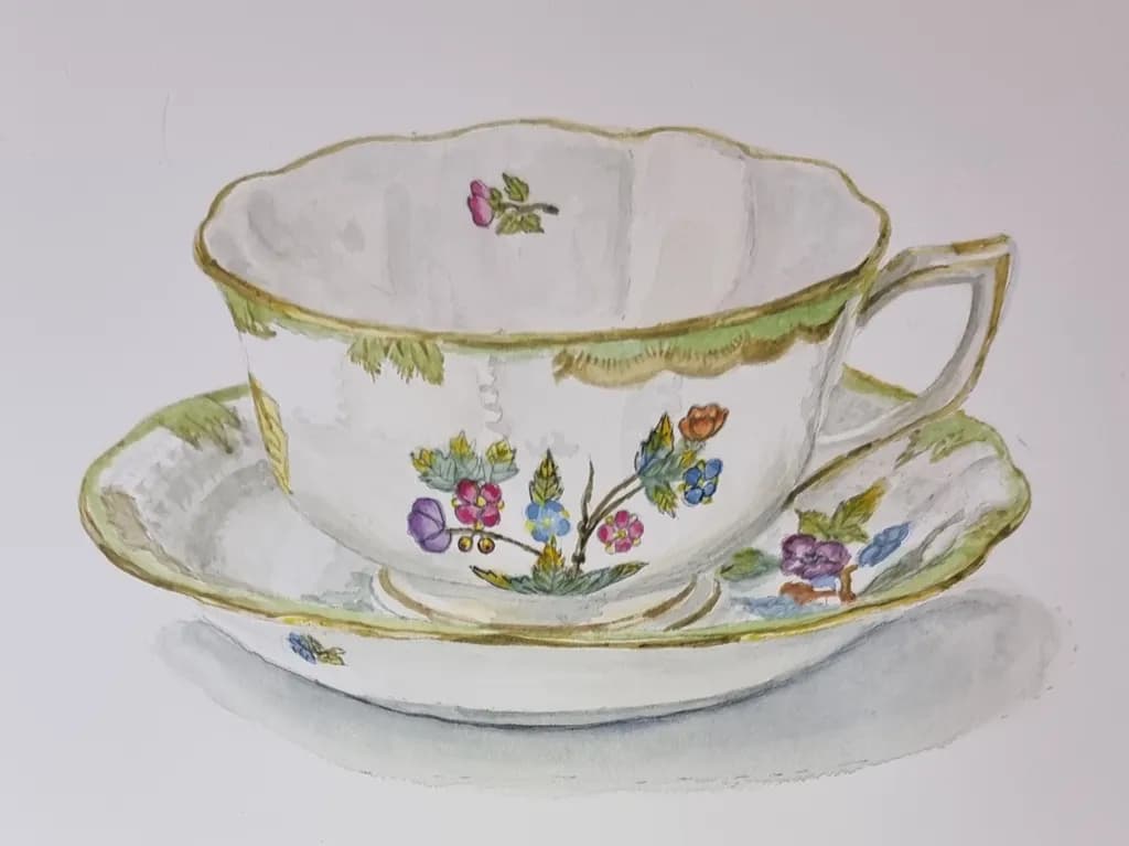 Delicate Floral Elegance: Vintage Porcelain Cup and Saucer Artistry