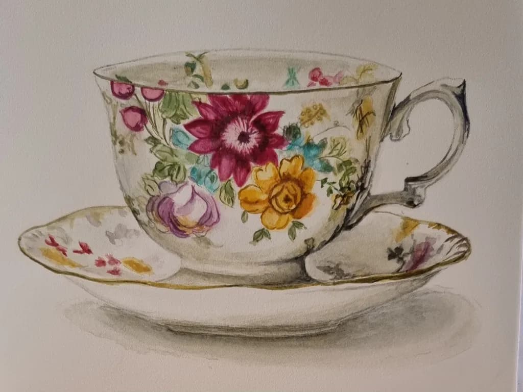 Delicate Floral Elegance: A Hand-Painted Tea Cup and Saucer Still Life