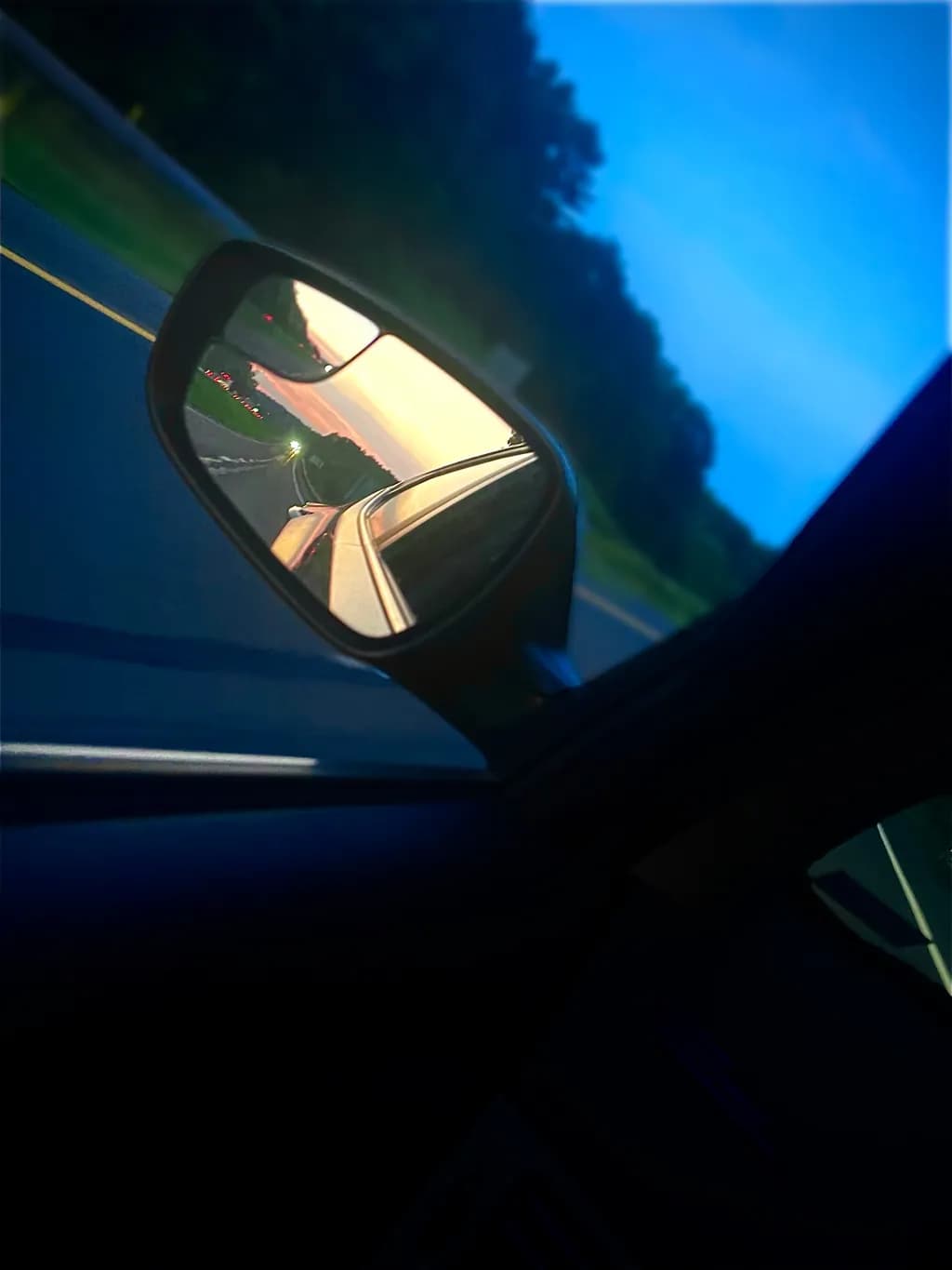 Reflections of a Journey: Sunset in the Rearview Mirror