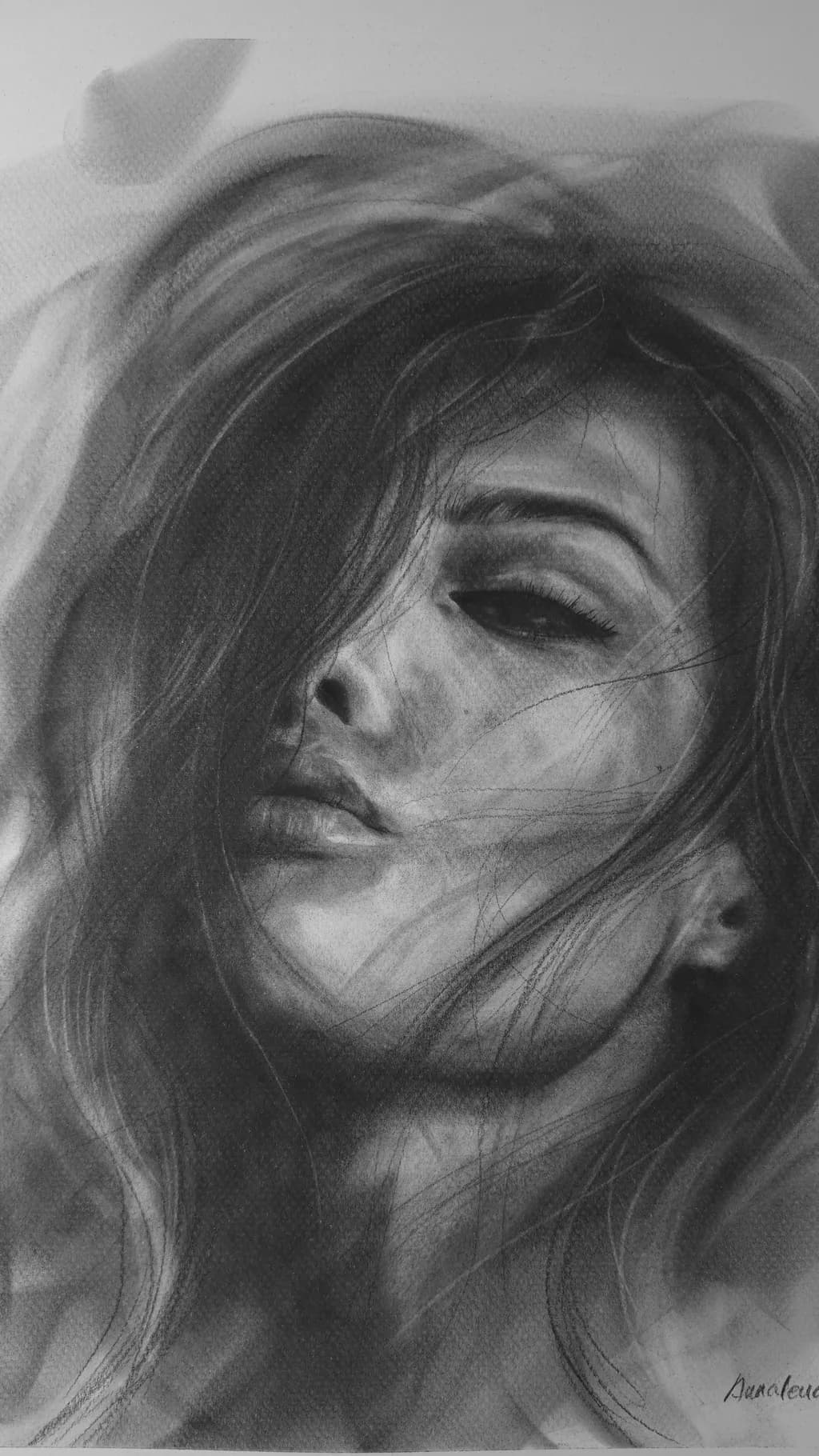 Whispers of Emotion: A Captivating Portrait in Charcoal and Light
