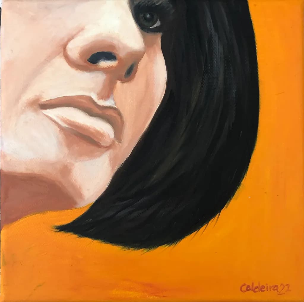 Whispers of Expression: A Portrait in Vibrant Orange