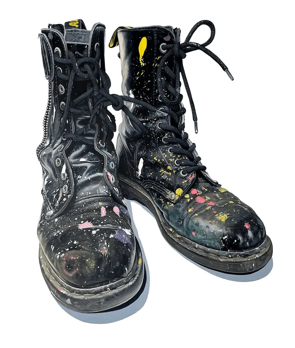 Stylish Black Boots with Colorful Paint Splatter: A Bold Artistic Statement