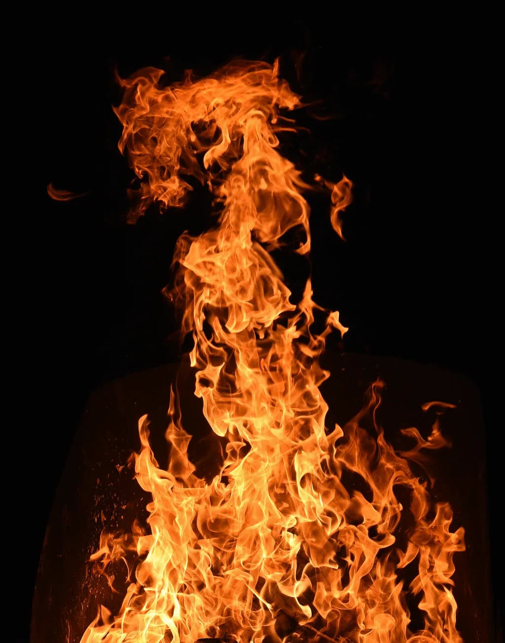 Dancing Flames: A Fiery Embrace of Light and Shadow