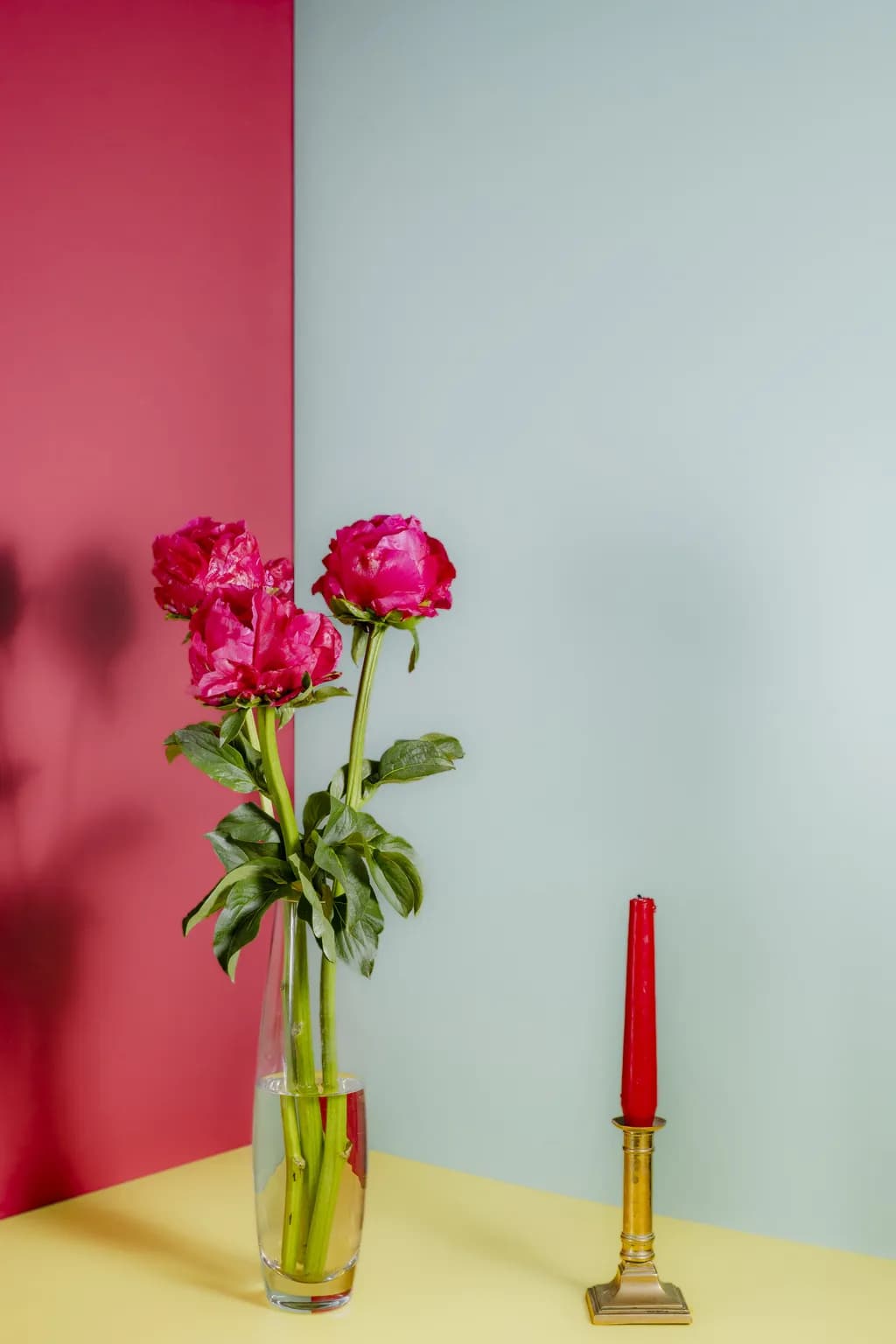 Red Peonies with a red candle
