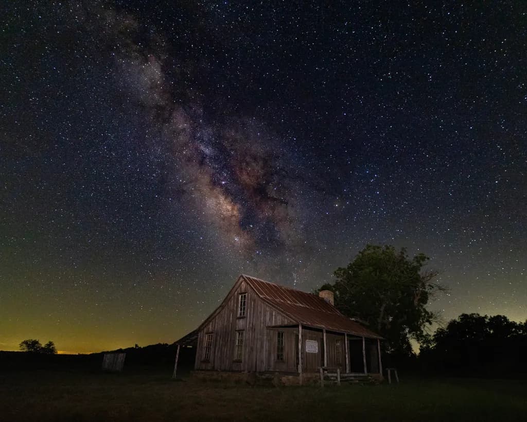 Whispers of the Galaxy: An Abandoned Homestead Under a Starry Night Sky