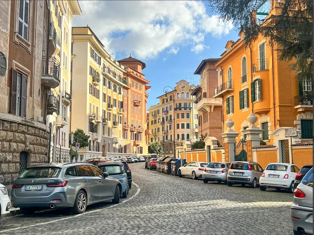 Charming Cobblestone Street: A Glimpse of Vibrant Italian Architecture and Urban Life