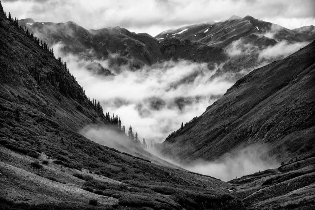 Whispers of the Mountains: A Journey Through Mist and Shadow in Black and White
