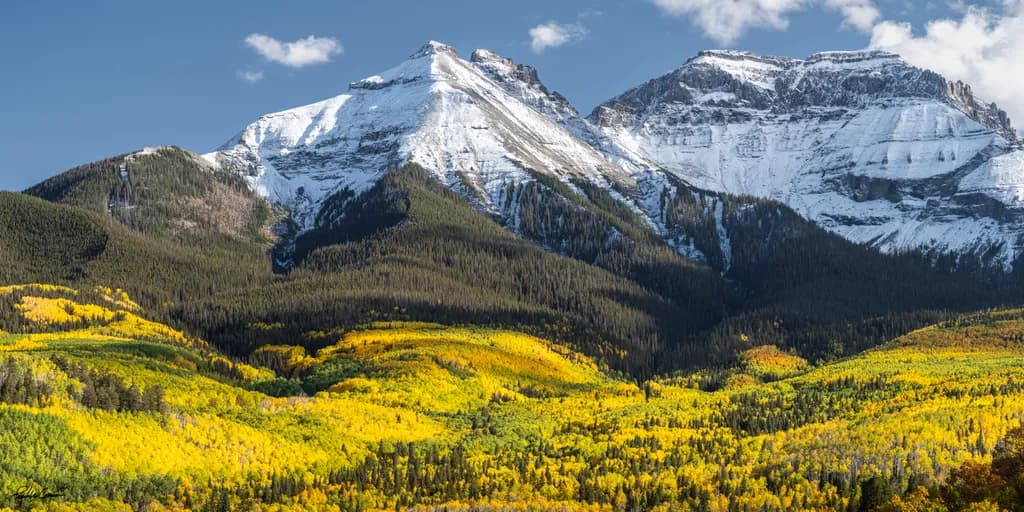 "Whispers of Autumn: A Majestic Dance of Snow-Capped Peaks and Golden Aspens"