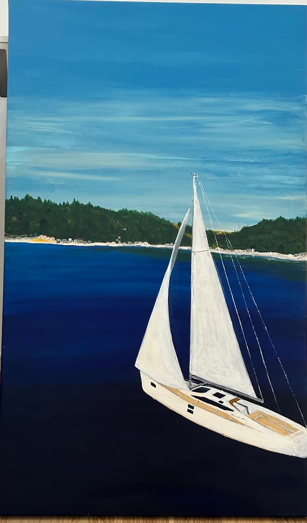 Serenity at Sea: A Sailboat's Journey Through Tranquil Waters