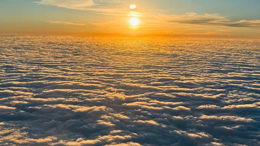 Whispers of Serenity: A Sunset Above the Clouds