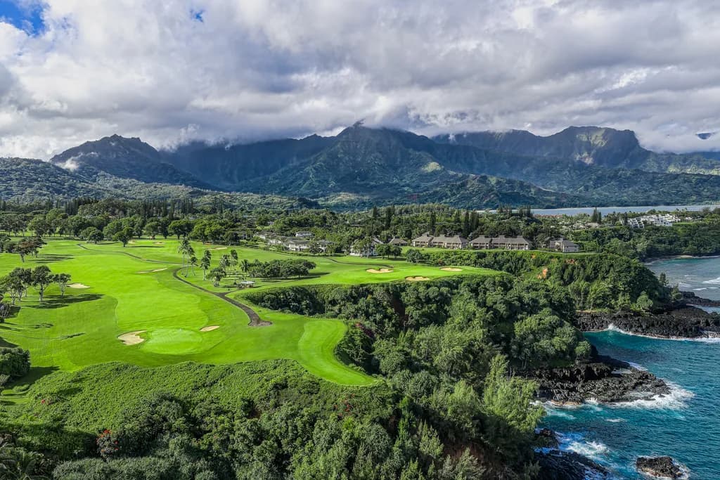 Serenity on the Green: A Coastal Golfing Paradise Amidst Majestic Mountains