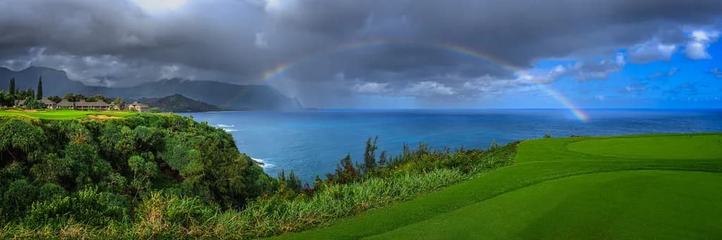 Whispers of the Ocean: A Rainbow's Embrace Over the Serene Coastline